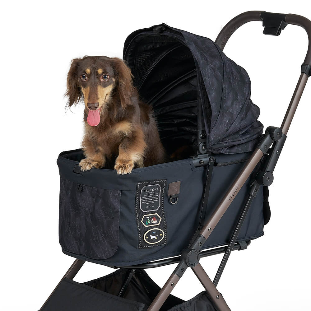 FikaGO FREE TO GO 2 pet stroller with a wiener dog lying on the cabin three-quarter view in strolling letters