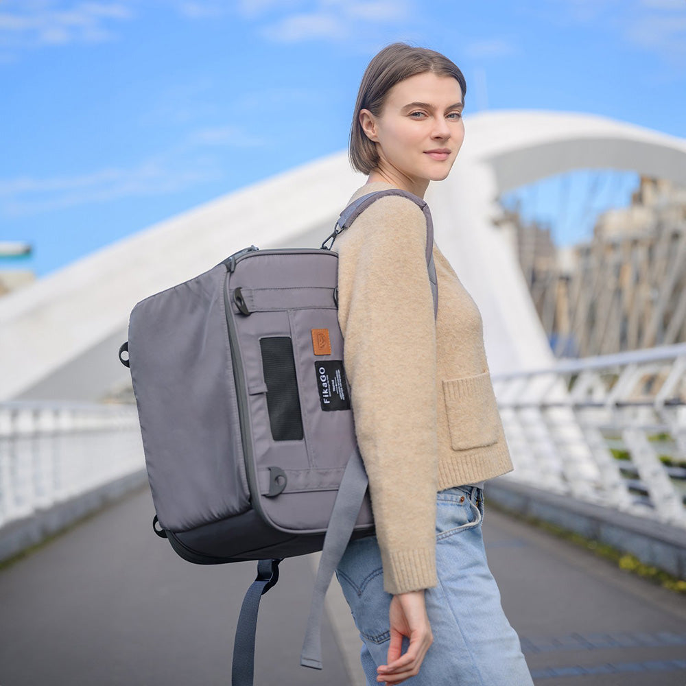 Person wearing FikaGO TRUFFLE carry-on pet bag as a backpack in grey