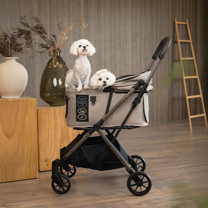 FikaGO FREE TO GO 2 pet stroller with a two malteses dog standing in the cabin in sandy beige in a nordic style living room