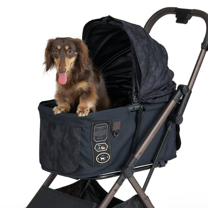 FikaGO FREE TO GO 2 pet stroller with a wiener dog lying on the cabin three-quarter view in strolling letters